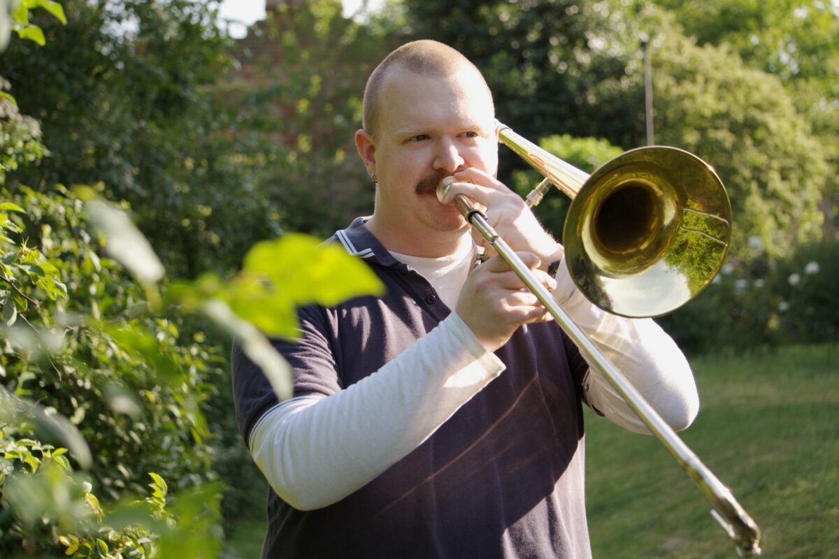 Elliot Hampton plays trombone.