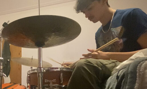 Luca Santos Sims playing drums. Luca Santos Sims playing drums.