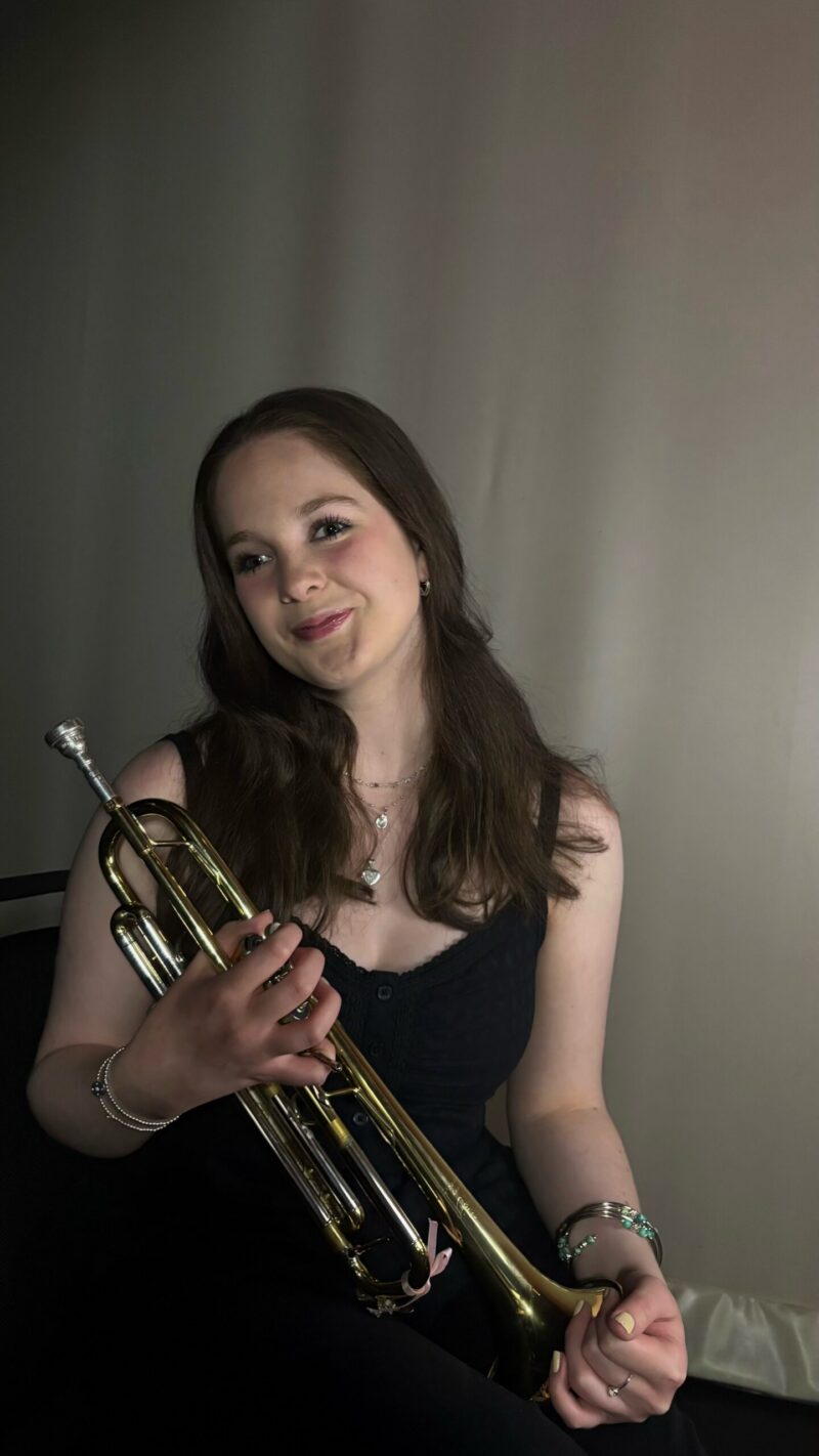 Poppy Hughes portrait Poppy Hughes plays trumpet.