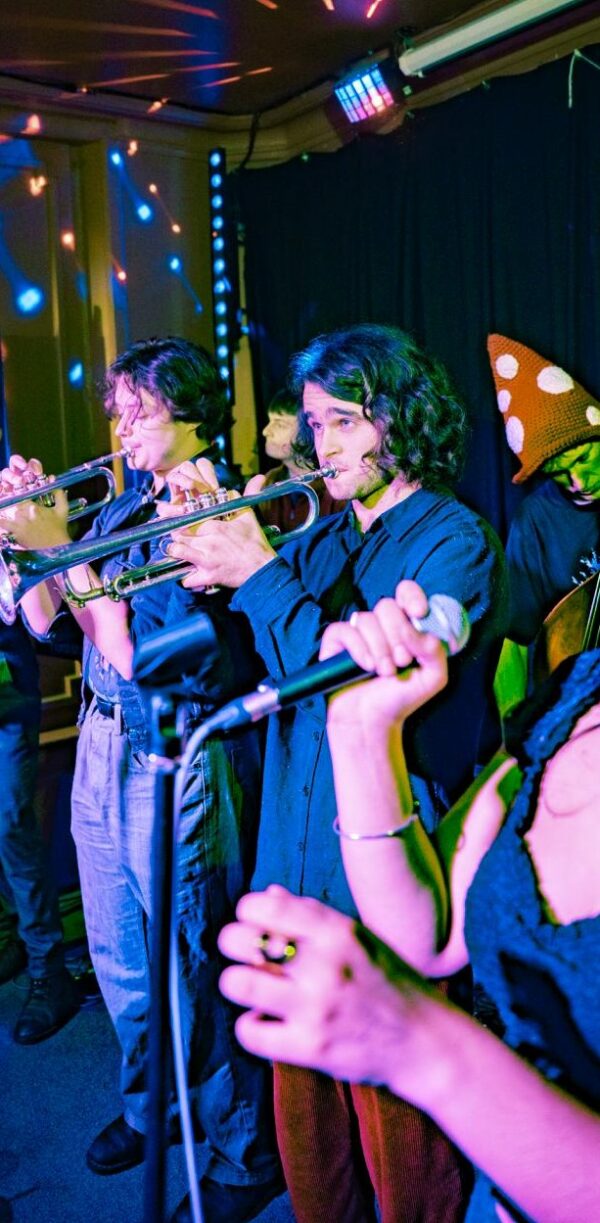Stan Lawrence plays trumpet on stage. Stan Lawrence plays trumpet on stage.