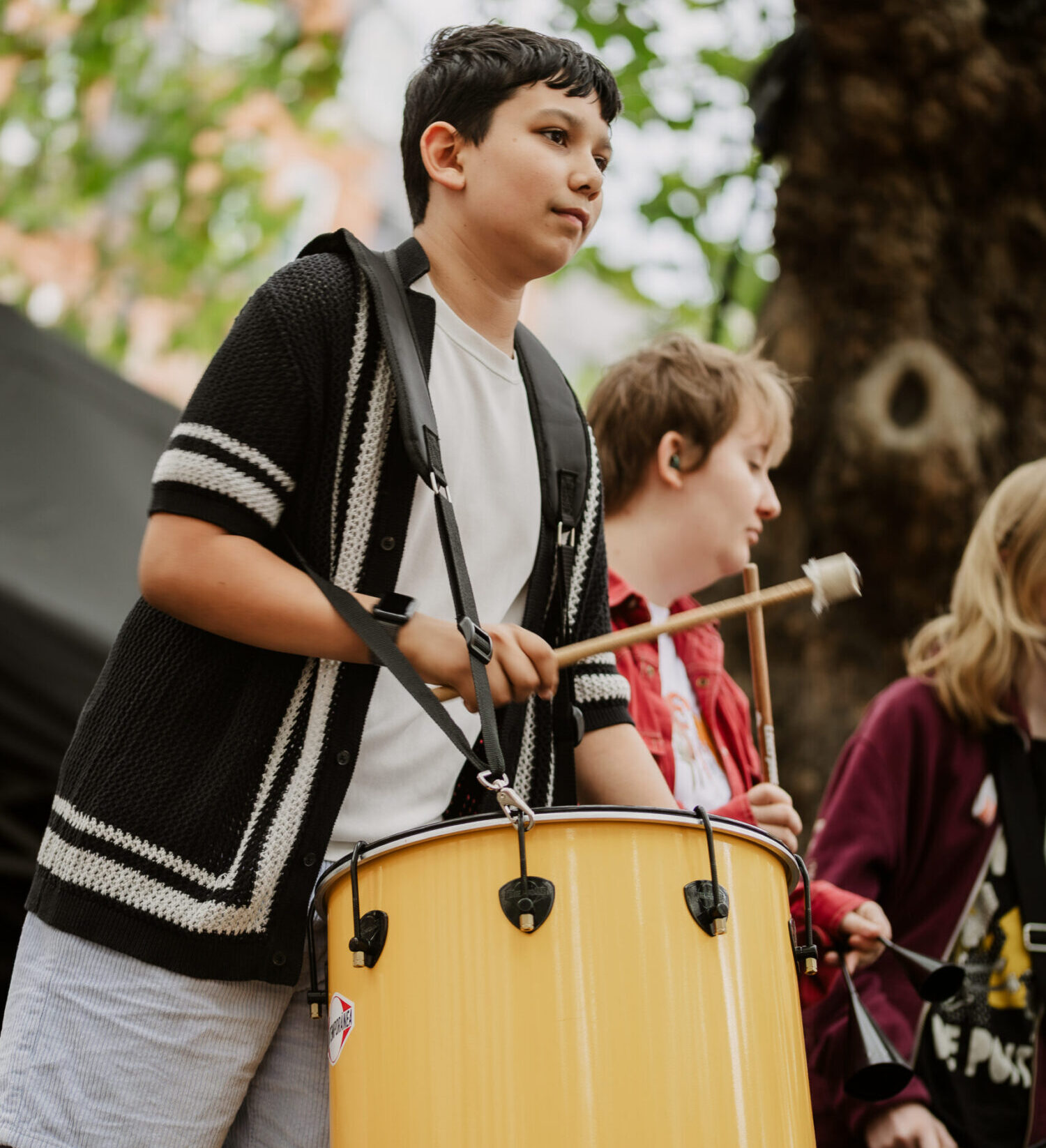 Young musician prepares to play drum Young musician prepares to play drum