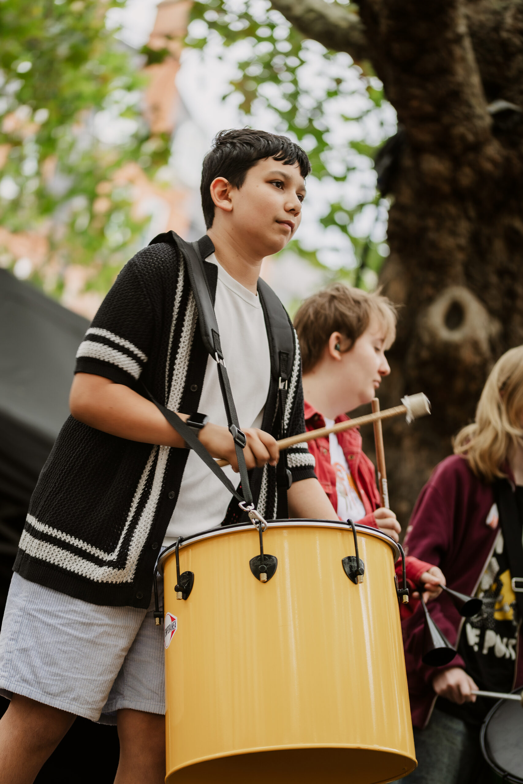 Young musician prepares to play drum Young musician prepares to play drum